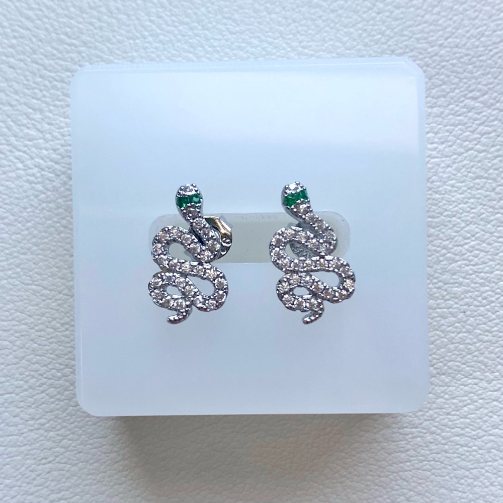 Silver snake earrings with green accents